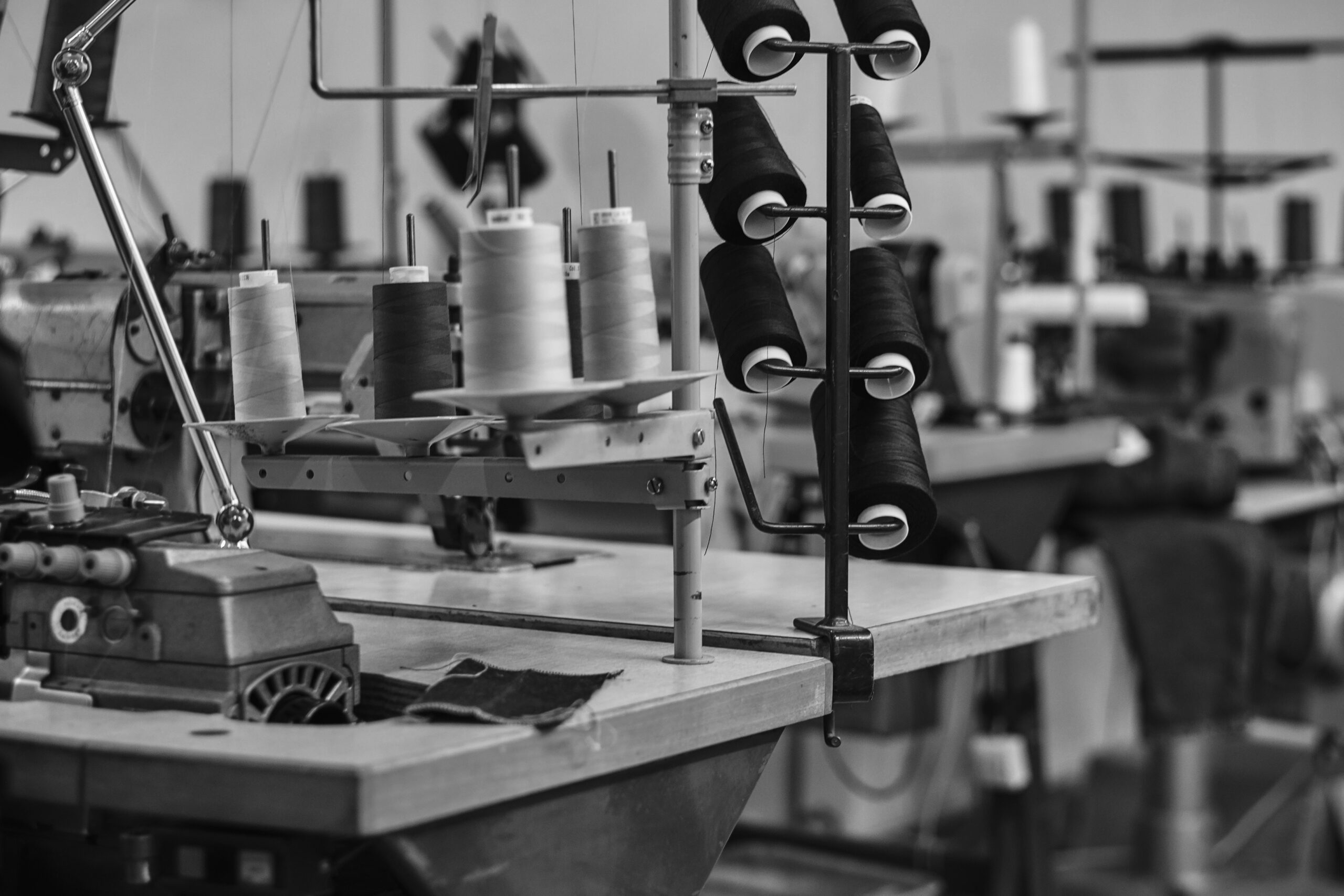 image of a lot of coils with a threads at the sewing workshop.